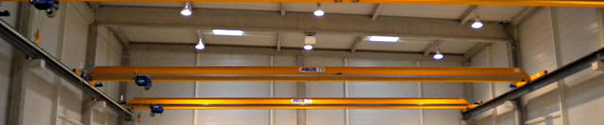 Three ABUS single girder overhead travelling cranes ELK with monorail trolley type E in the company HBSF in France 