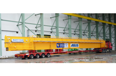 Bridge crane on its way to the company Autolaunch Ltd. to help workers there build pressed parts for the automotive industry