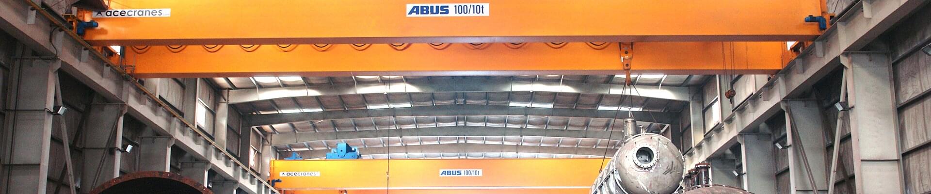 ABUS double girder overhead travelling crane with a load capacity of 100 t in a production facility of DESCON Engineering HFZC in the United Arab Emirates. 