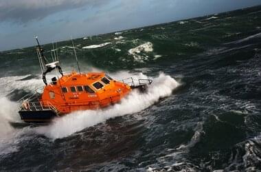 Royal National Lifeboat Institution lifeboat on the high seas on the coast of England