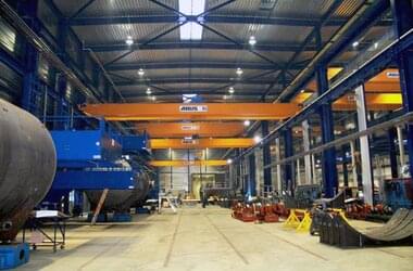 Double girder travelling cranes in tandem control in company Stork Thermeq in Netherlands