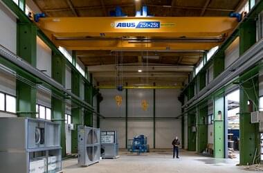 Double girder travelling crane with two wire rope hoists in new hall in Finland