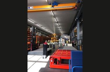 Active single girder travelling crane with spreader beam in Dutch company Kiremko