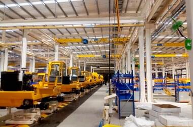 HB-Systems and single girder traveling cranes in production for truck mixers in India