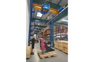 Employee operates HB system with GM4 electric chain hoist 