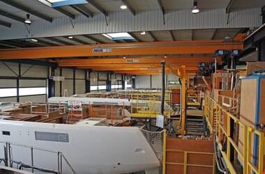 Single girder travelling cranes in production hall for catamarans of the company Construction Navale Bordeaux