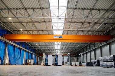 Mounted double girder travelling crane in large hall in Poland