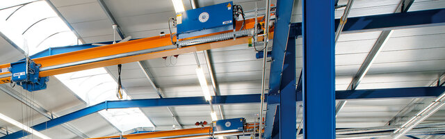 The control components of a crane system are mounted on the girder and control the system's movements.