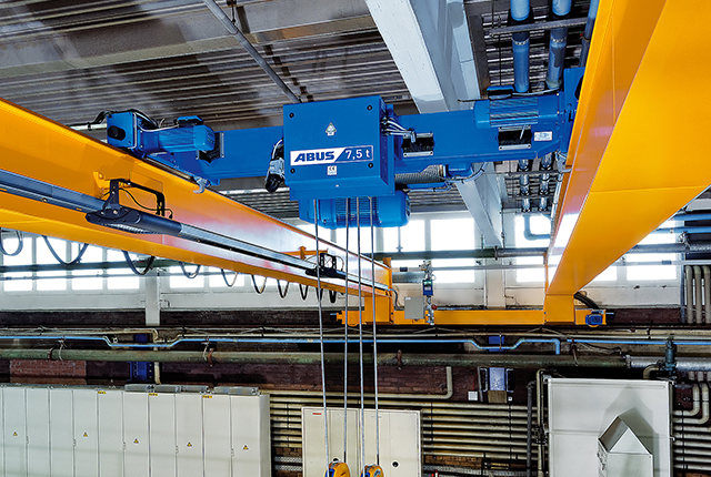 ABUS DA-type double-girder trolley for low headroom and load capacities up to 40 tons in crane systems.